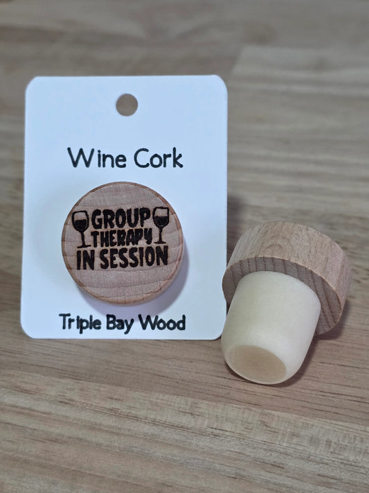 Wood wine cork "group therapy in session on white cardstock 